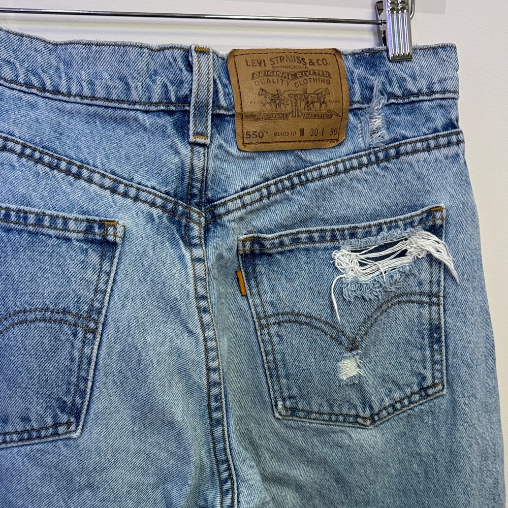 Levi's Classic Blue Denim Jeans with Distressed Pocket